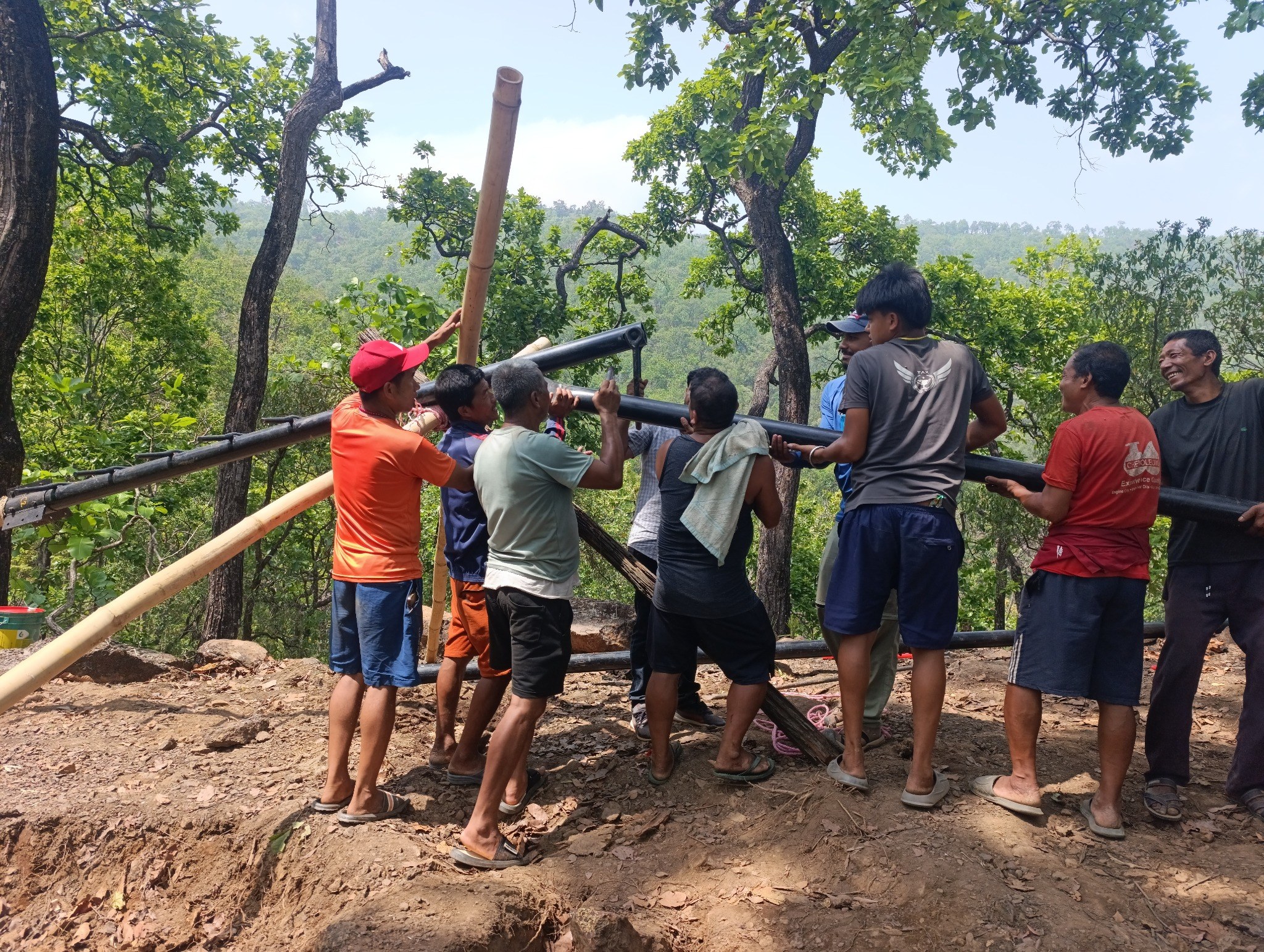 Field crew mobilising drilling equipment at Phaparbari